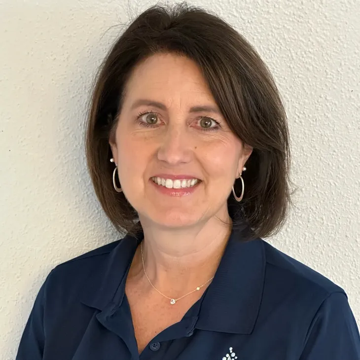 Woman smiling in blue shirt